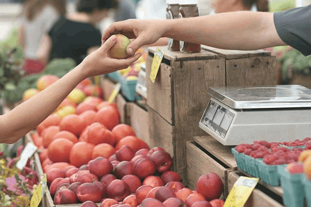 a customer buying apples